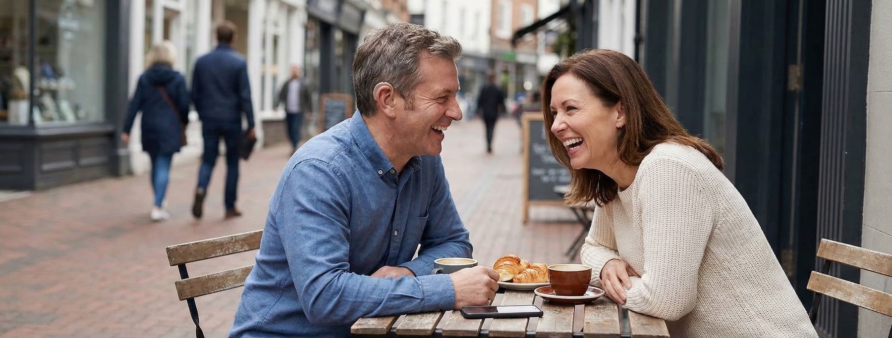 Man and women catching up over breakfast