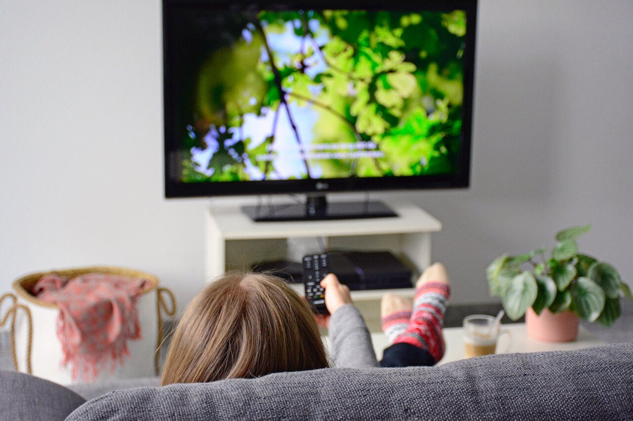 Women Watching Closed Caption On Television